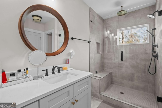 bathroom featuring a stall shower and vanity