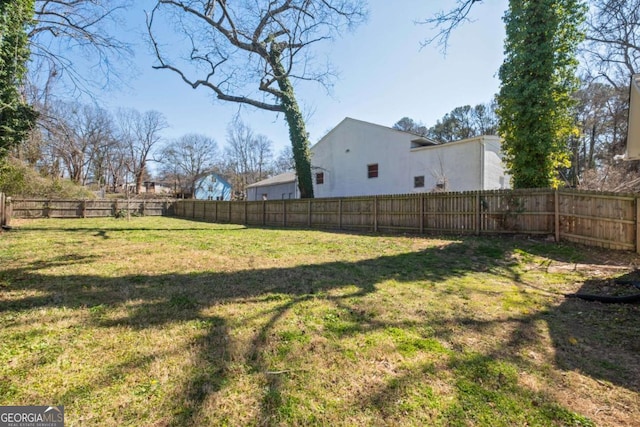 view of yard featuring a fenced backyard