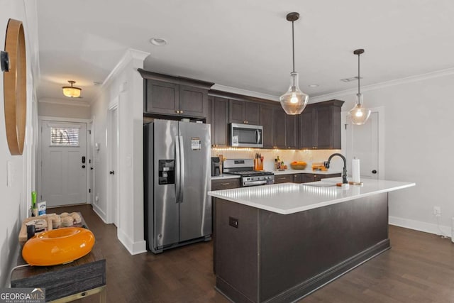 kitchen featuring appliances with stainless steel finishes, ornamental molding, light countertops, dark brown cabinets, and a sink