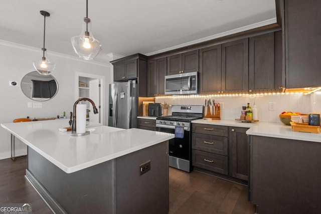 kitchen featuring dark wood-style floors, light countertops, and appliances with stainless steel finishes