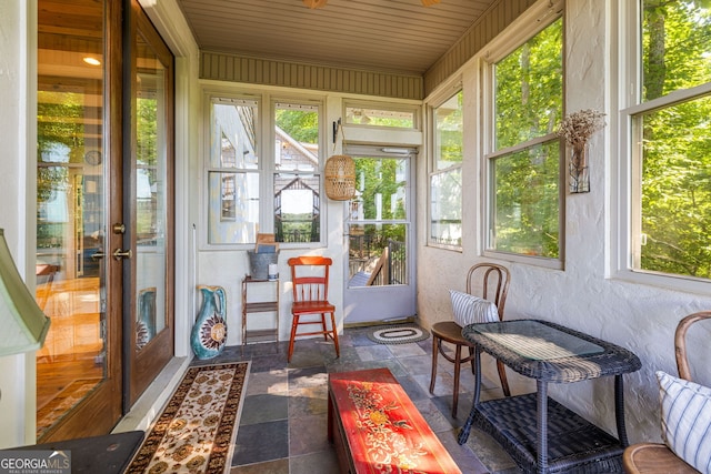 sunroom featuring a healthy amount of sunlight