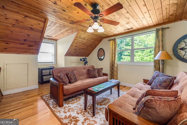 living room with vaulted ceiling, wood ceiling, light wood-style flooring, and baseboards