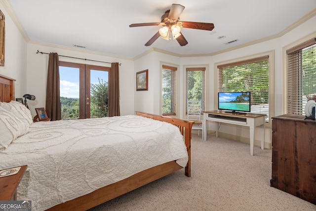 bedroom featuring multiple windows, visible vents, and crown molding