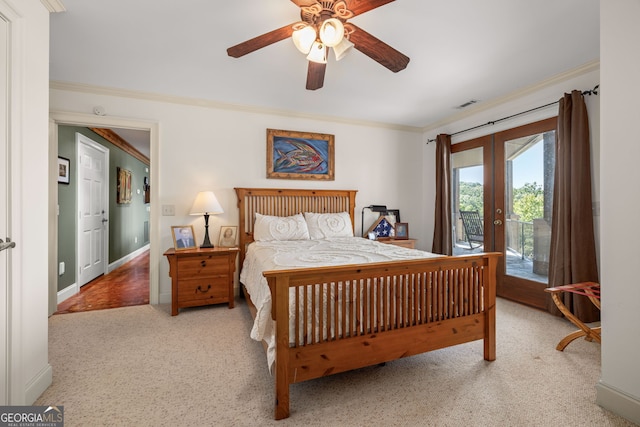 carpeted bedroom with visible vents, a ceiling fan, ornamental molding, access to outside, and french doors