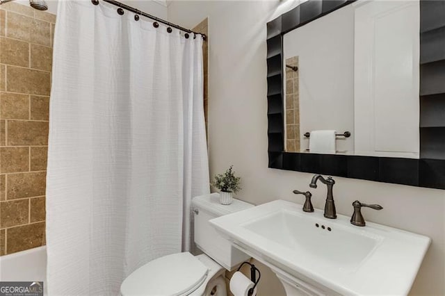 bathroom with a sink and toilet