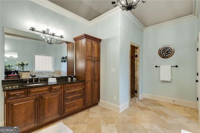 full bathroom with crown molding, a notable chandelier, a stall shower, vanity, and baseboards