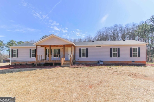 manufactured / mobile home featuring a porch, crawl space, and a front lawn