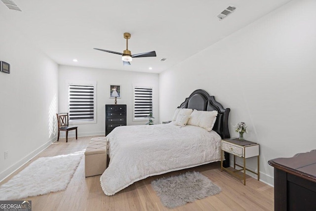 bedroom with baseboards, recessed lighting, visible vents, and light wood-style floors