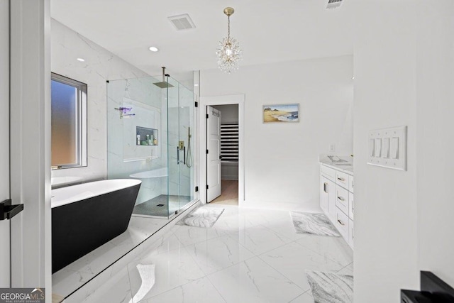 full bath with a freestanding tub, visible vents, vanity, marble finish floor, and a marble finish shower