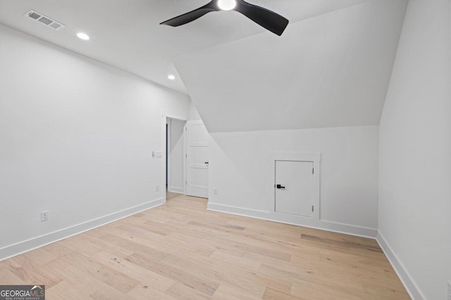 bonus room featuring baseboards, visible vents, ceiling fan, and light wood finished floors