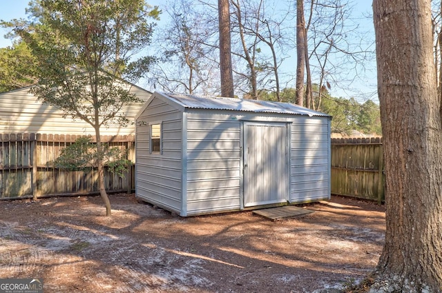 view of shed featuring a fenced backyard