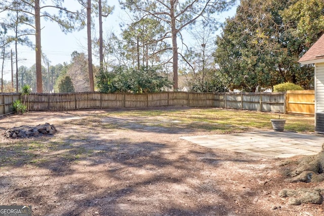 view of yard with a patio area and a fenced backyard