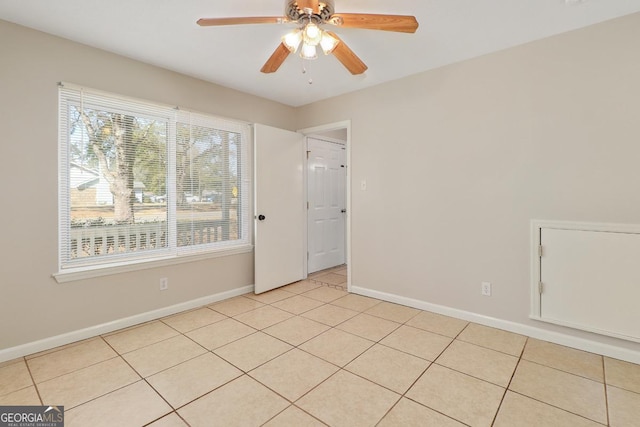 2 Hickory Rd, Rincon, GA 31326 - unfurnished room with baseboards, a ceiling fan, and light tile patterned floors