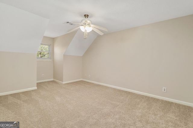 bonus room with ceiling fan, carpet floors, visible vents, baseboards, and vaulted ceiling