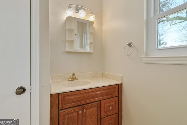 bathroom with a wealth of natural light and vanity