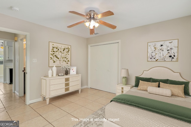 2 Hickory Rd, Rincon, GA 31326 - bedroom with light tile patterned floors, a closet, baseboards, and ceiling fan