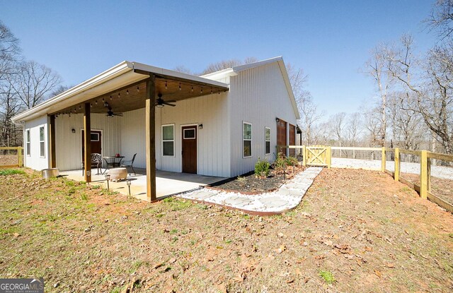 rear view of house with a patio area, ceiling fan, a gate, and fence