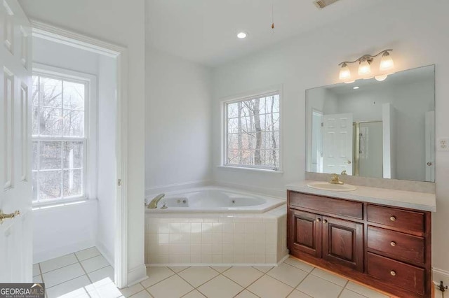 full bathroom with a shower with shower door, tile patterned flooring, a garden tub, and vanity