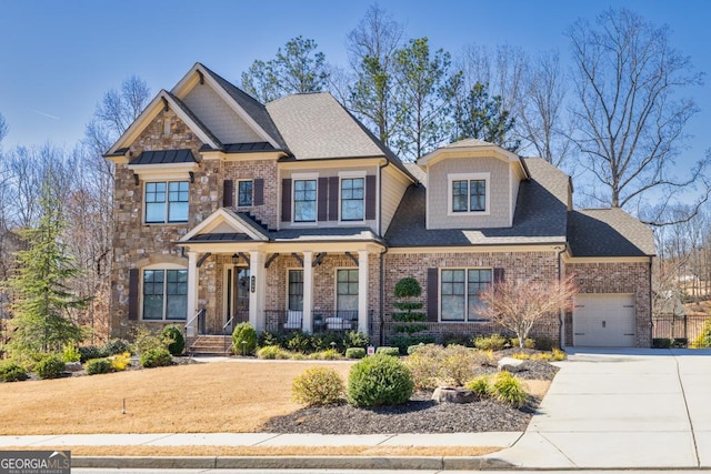 craftsman-style house featuring brick siding, roof with shingles, a porch, concrete driveway, and an attached garage