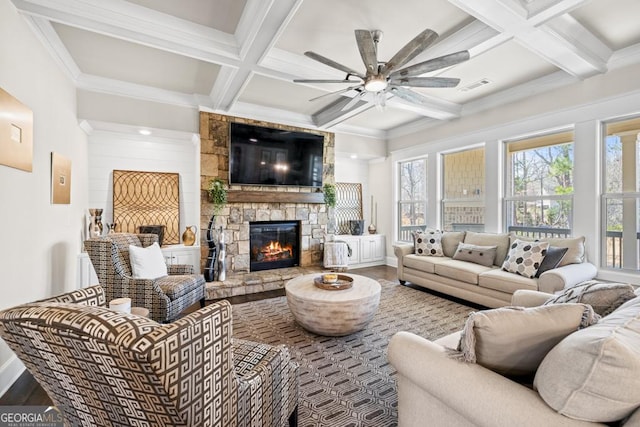 4590 Gablestone Xing, Hoschton, GA 30548 - living room with coffered ceiling, a stone fireplace, a ceiling fan, baseboards, and ornamental molding