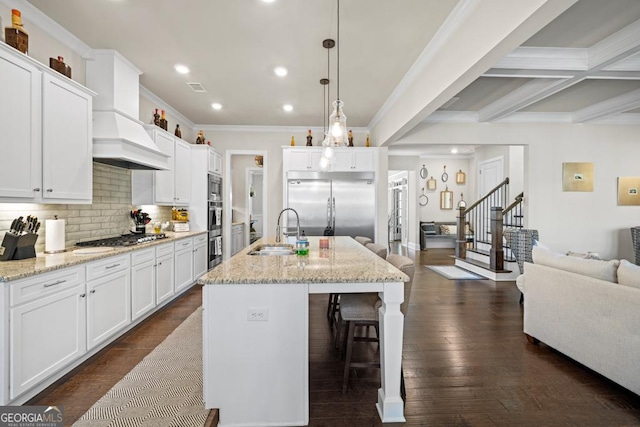 4590 Gablestone Xing, Hoschton, GA 30548 - kitchen featuring a sink, stainless steel appliances, recessed lighting, a kitchen bar, and crown molding