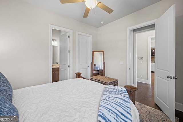 4590 Gablestone Xing, Hoschton, GA 30548 - bedroom with wood finished floors, ceiling fan, baseboards, and ensuite bath