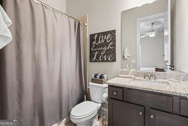 4590 Gablestone Xing, Hoschton, GA 30548 - ensuite bathroom with ceiling fan, toilet, vanity, and curtained shower