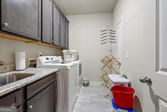 4590 Gablestone Xing, Hoschton, GA 30548 - laundry area with washer and clothes dryer, cabinet space, and baseboards