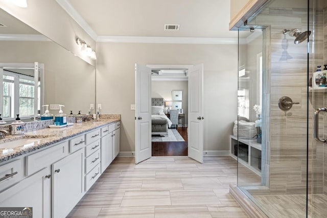 4590 Gablestone Xing, Hoschton, GA 30548 - ensuite bathroom featuring crown molding, a stall shower, double vanity, and baseboards