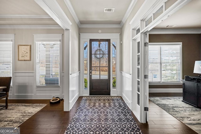 4590 Gablestone Xing, Hoschton, GA 30548 - entryway featuring dark wood-type flooring, a decorative wall, ornamental molding, and a wainscoted wall