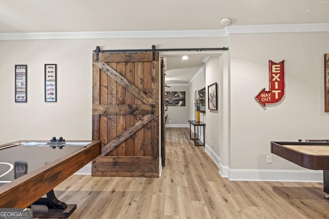 4590 Gablestone Xing, Hoschton, GA 30548 - hallway featuring crown molding, wood finished floors, a barn door, and baseboards
