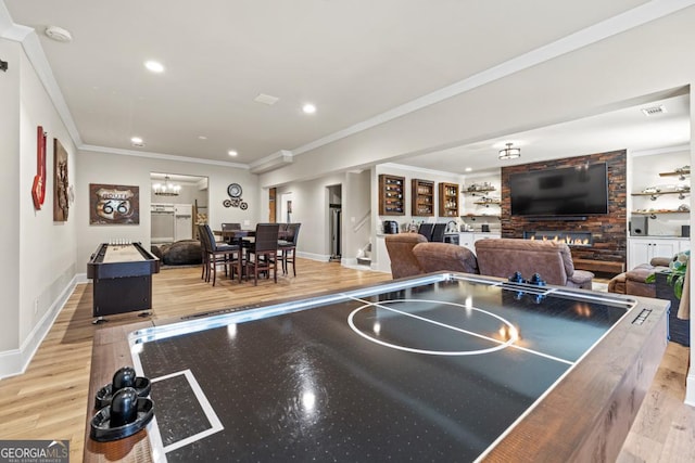 4590 Gablestone Xing, Hoschton, GA 30548 - game room with wood finished floors, baseboards, ornamental molding, recessed lighting, and a chandelier