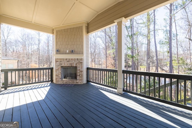 4590 Gablestone Xing, Hoschton, GA 30548 - wooden deck featuring an outdoor brick fireplace