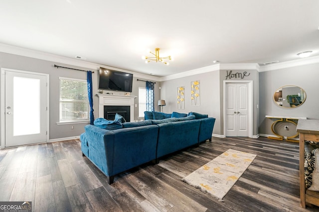 living room featuring ornamental molding, a fireplace, and wood finished floors