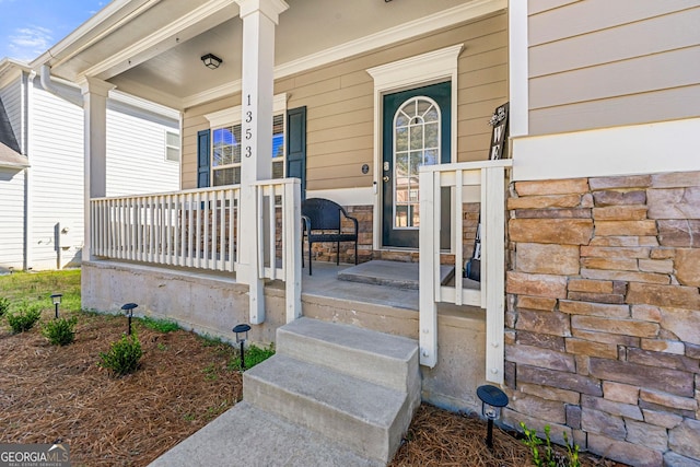 entrance to property with covered porch