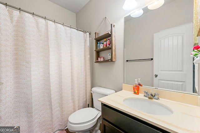 full bathroom featuring vanity and toilet