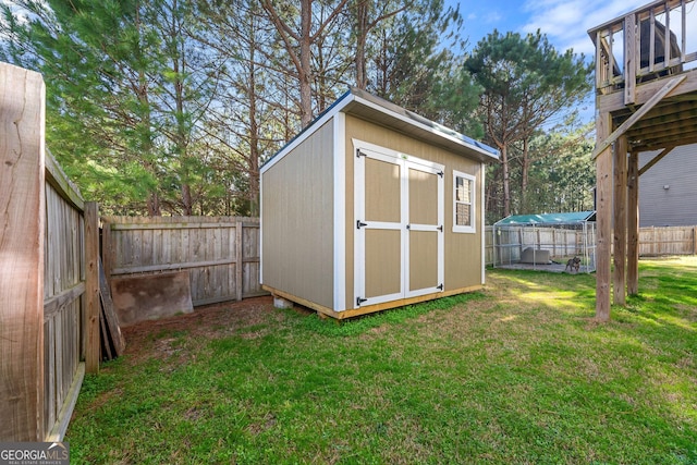 view of shed featuring a fenced backyard