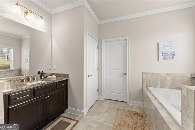 full bath featuring ornamental molding, vanity, baseboards, and a bath