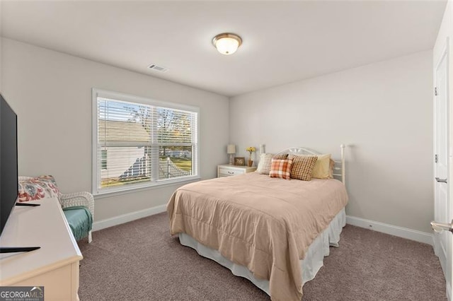 bedroom featuring carpet, visible vents, and baseboards