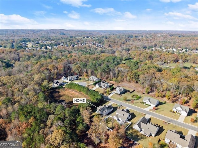 aerial view with a residential view and a view of trees