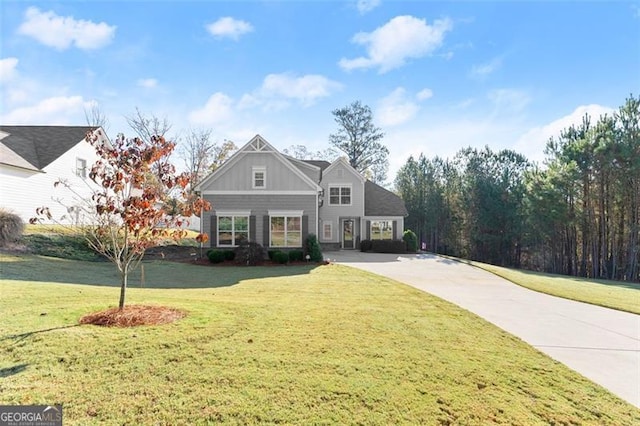 view of front of house featuring board and batten siding and a front yard