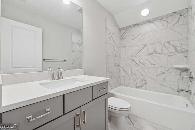 full bath featuring toilet, marble finish floor, shower / washtub combination, and vanity