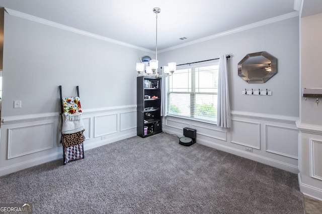 unfurnished dining area with carpet floors, a chandelier, crown molding, and wainscoting