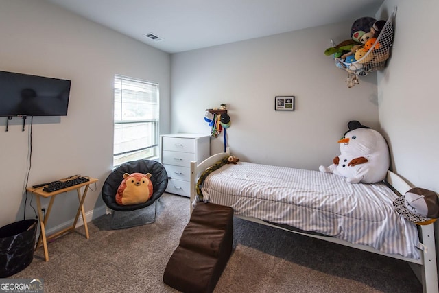 bedroom with baseboards, visible vents, and carpet flooring