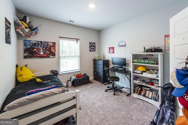 carpeted bedroom featuring baseboards and visible vents