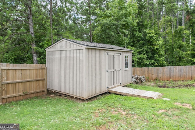 view of shed featuring a fenced backyard