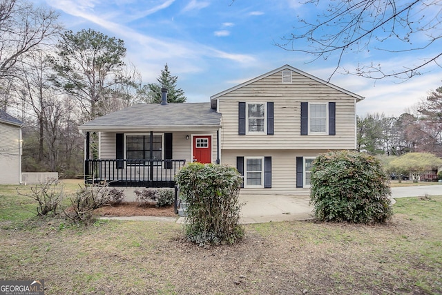 split level home with covered porch