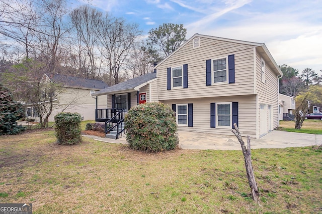 split level home with a front yard and driveway