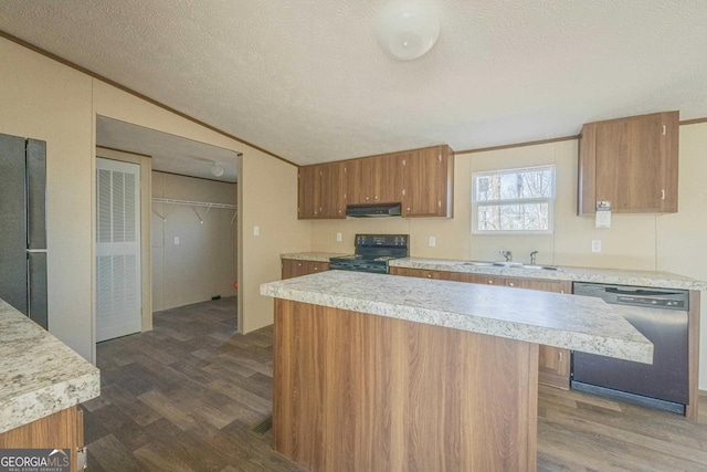 kitchen with brown cabinetry, a sink, black appliances, and ornamental molding