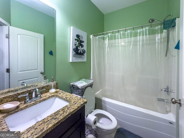 full bath with shower / tub combo, vanity, and toilet